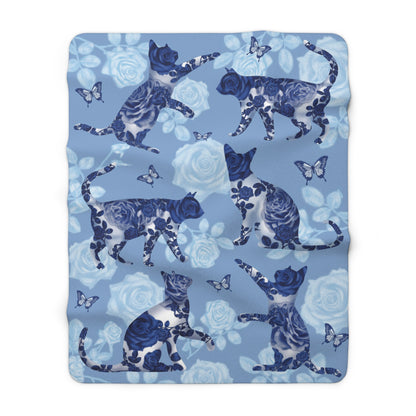 Blue fleece blanket with cats, butterflies and floral pattern.