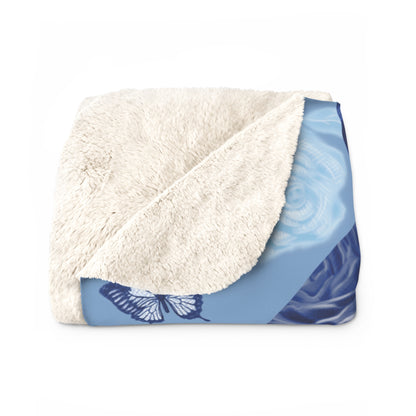 Blue fleece blanket with cats, butterflies and floral pattern.