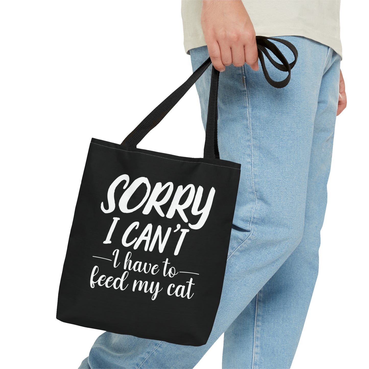 "Sorry I can't i have to feed my cat" black tote bag