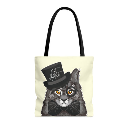 Cream Tote bag with a Maine Coon cat illustration and the text "Cat Addict." 