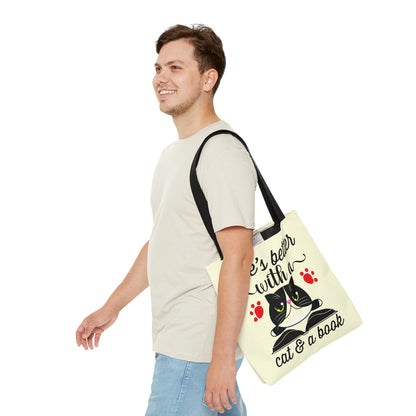 Cream Tote bag with a cat illustration and text 'life's better with a cat & a book'  