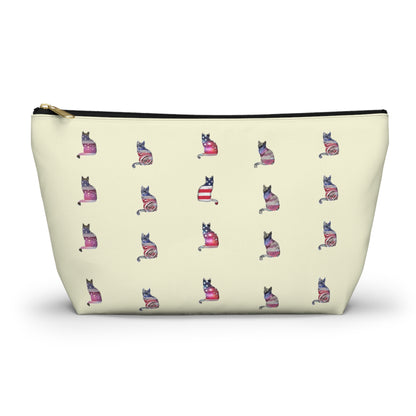 Cream color zipped accessory bag for organising makeup, cosmetics, travel essentials, toiltries, pencil case with 'LOVE' text and cat graphics in the colors of the American flag.