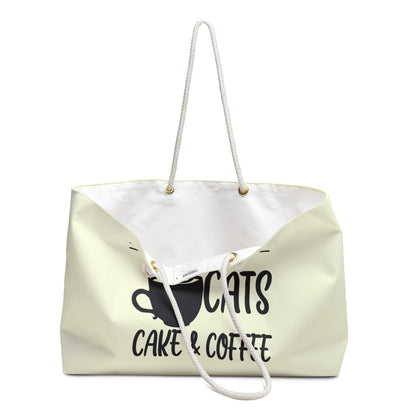 Cream colored weekender tote bag with the text 'I Want Cats, Cake & Coffee' and graphic of cat and coffee cup