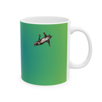Green mug and graphic of a cat in a yoga pose.