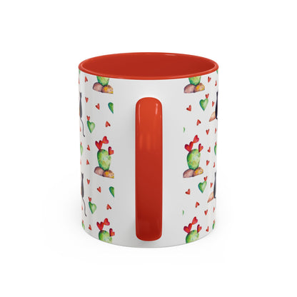 Mug featuring cat, heart and cactus pattern.