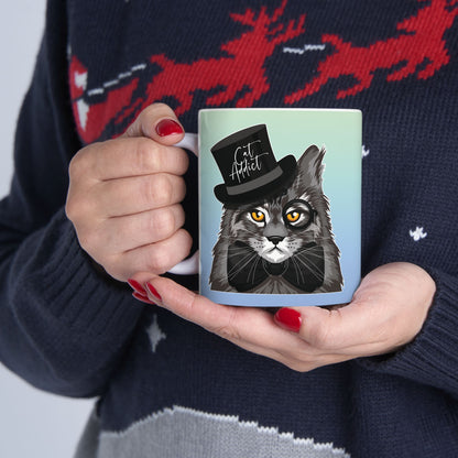Mug with a Maine Coon cat illustration and the text 'Cat Addict.'