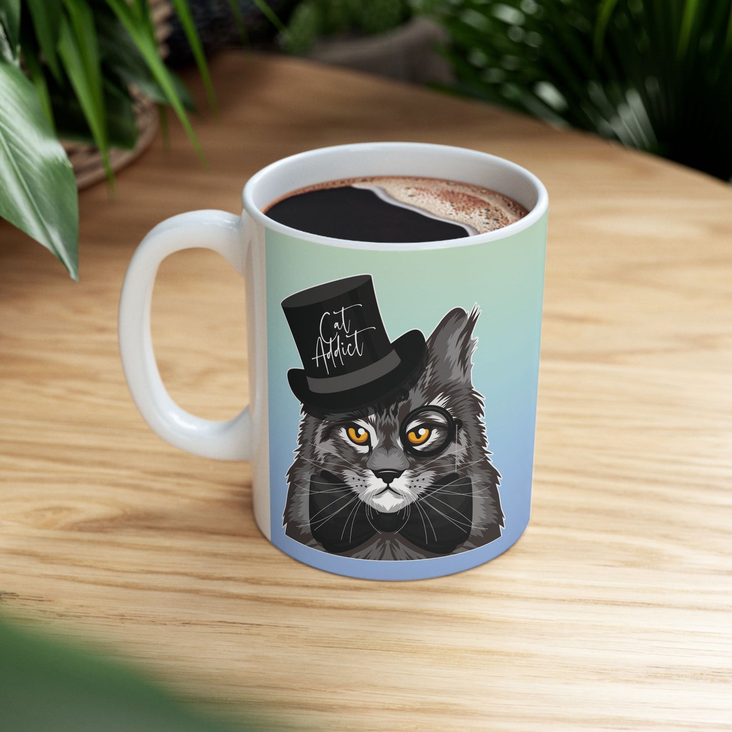 Mug with a Maine Coon cat illustration and the text 'Cat Addict.'