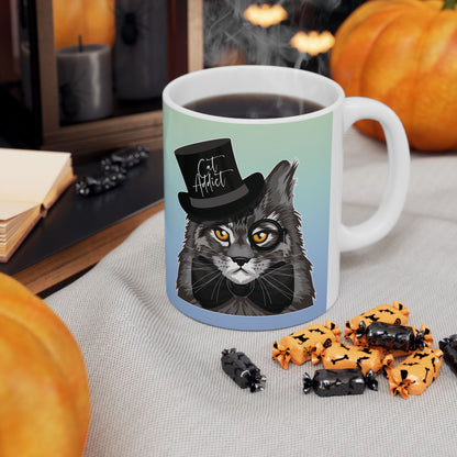Mug with a Maine Coon cat illustration and the text 'Cat Addict.'
