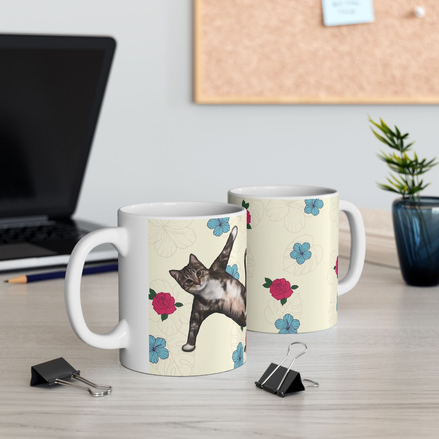Mug with a cat in a yoga pose on a floral background.