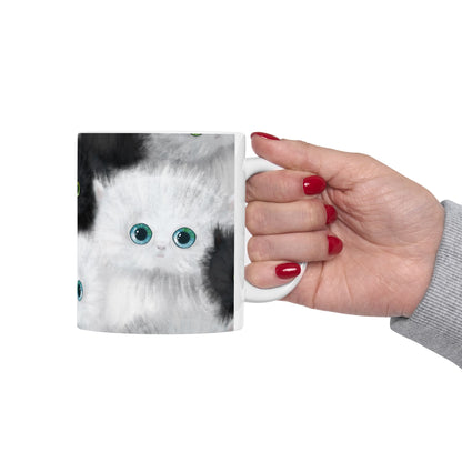 Mug with a design of black and white kittens.