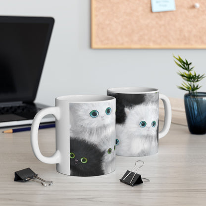 Mug with a design of black and white kittens.