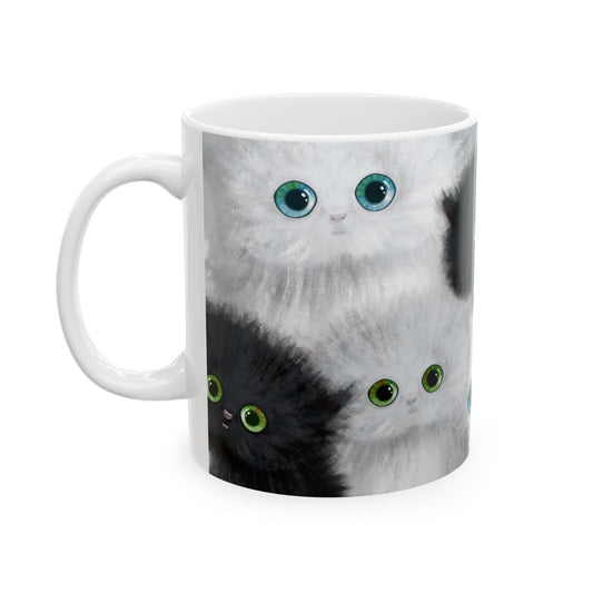 Mug with a design of black and white kittens.