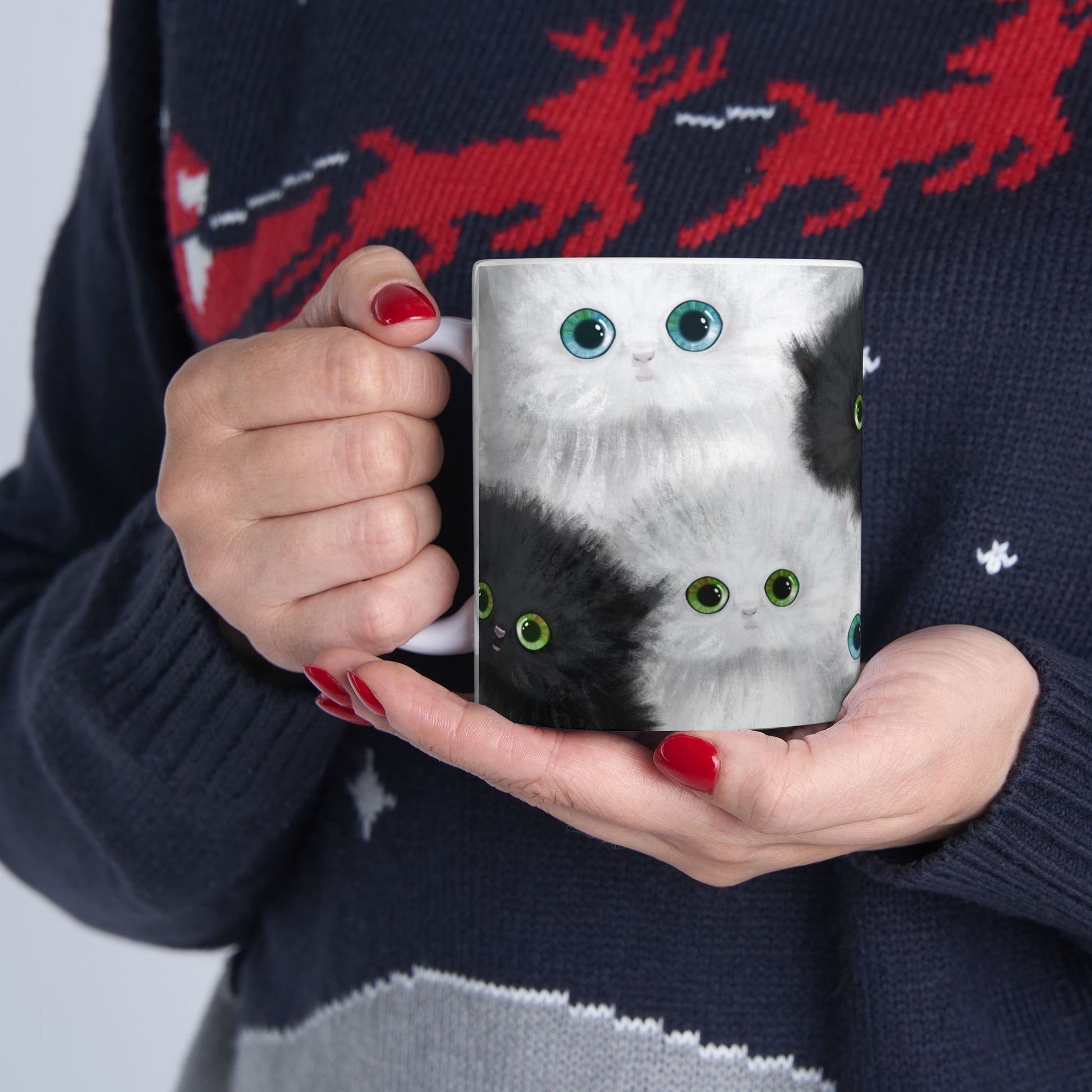 Mug with a design of black and white kittens.