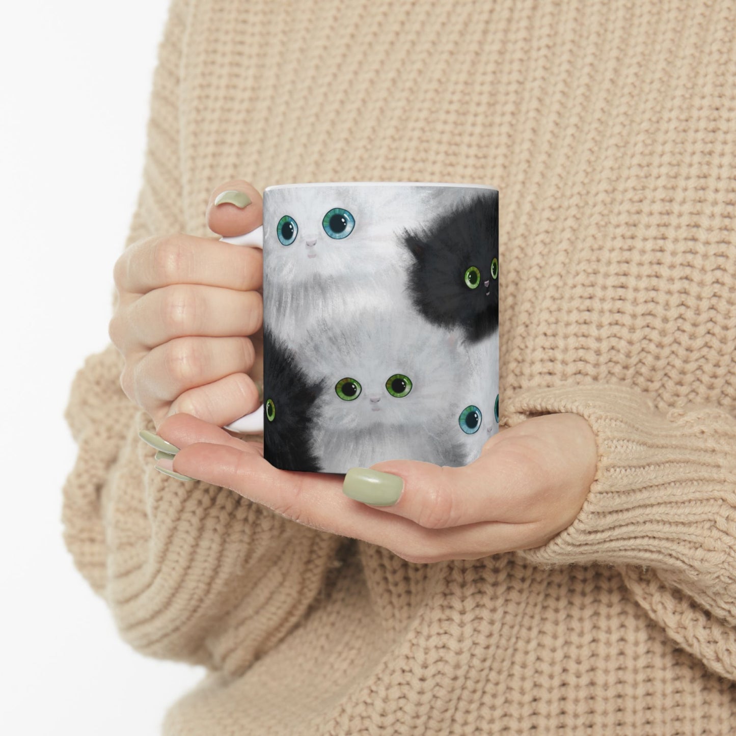Mug with a design of black and white kittens.
