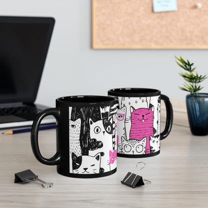 Black mug with cartoon cat illustrations.