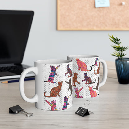White mug with colorful cat pattern. 