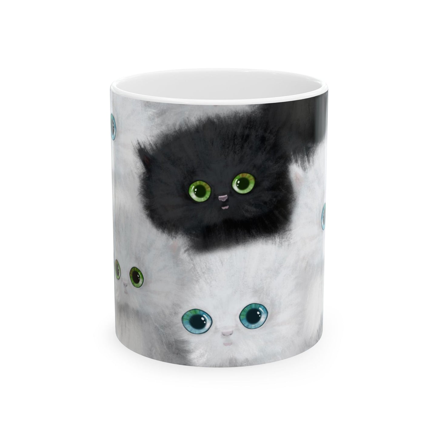 Mug with a design of black and white kittens.