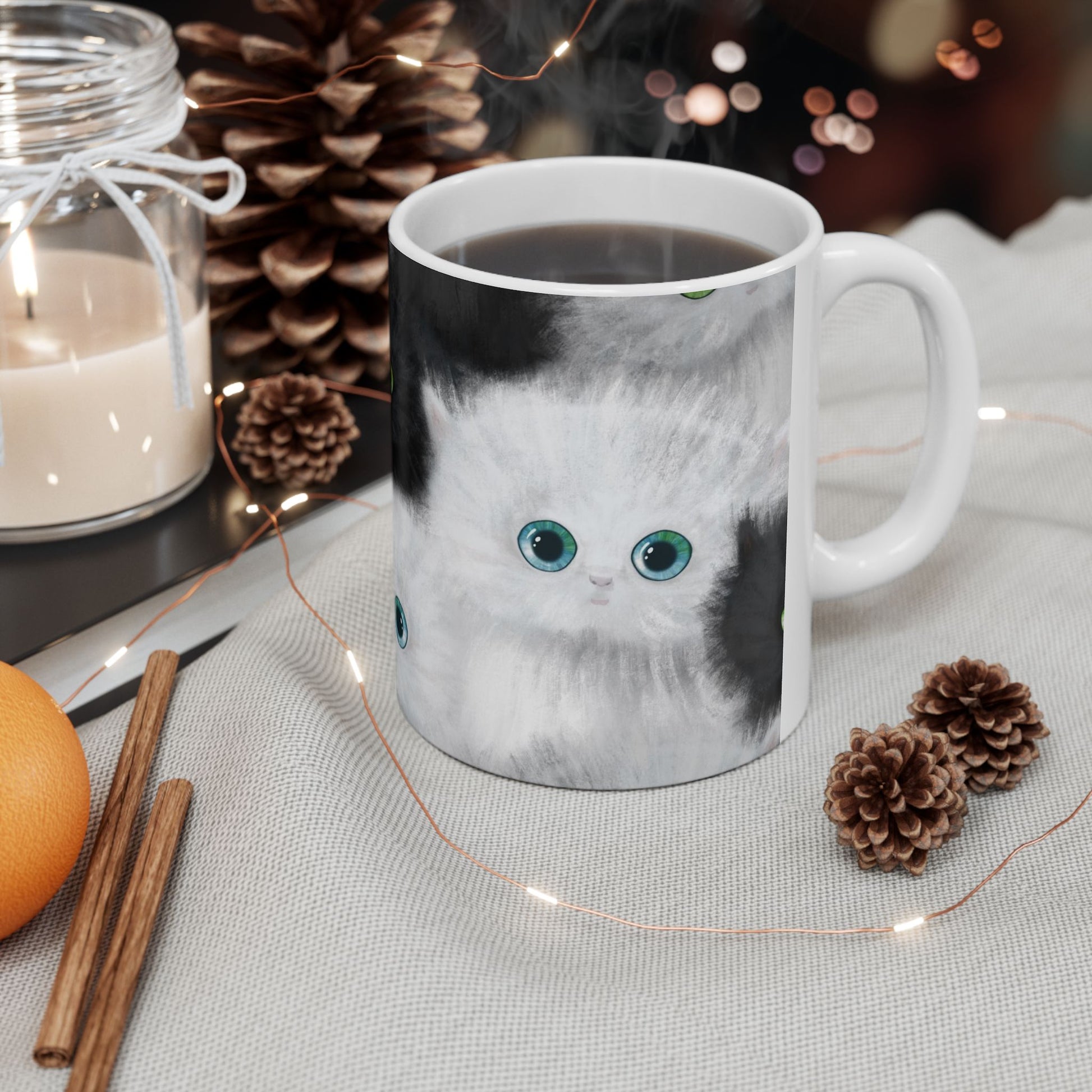 Mug with a design of black and white kittens.