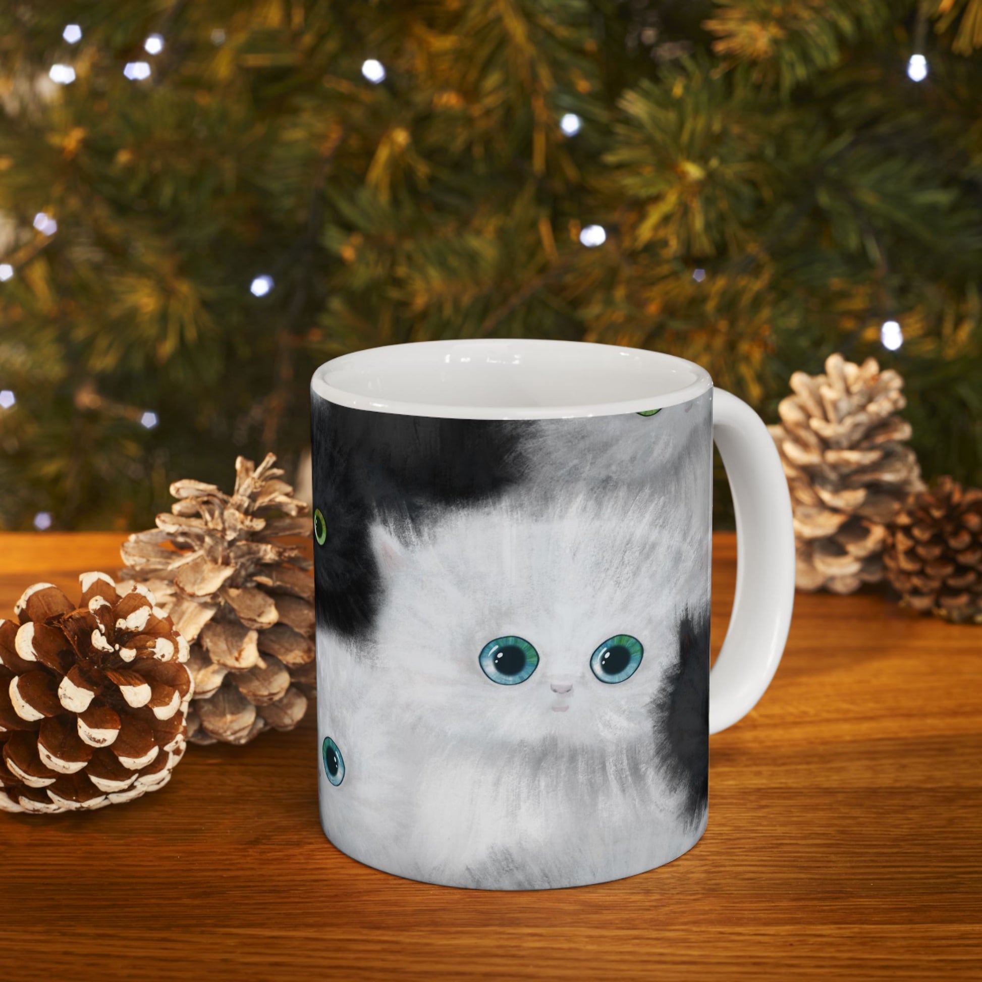 Mug with a design of black and white kittens.