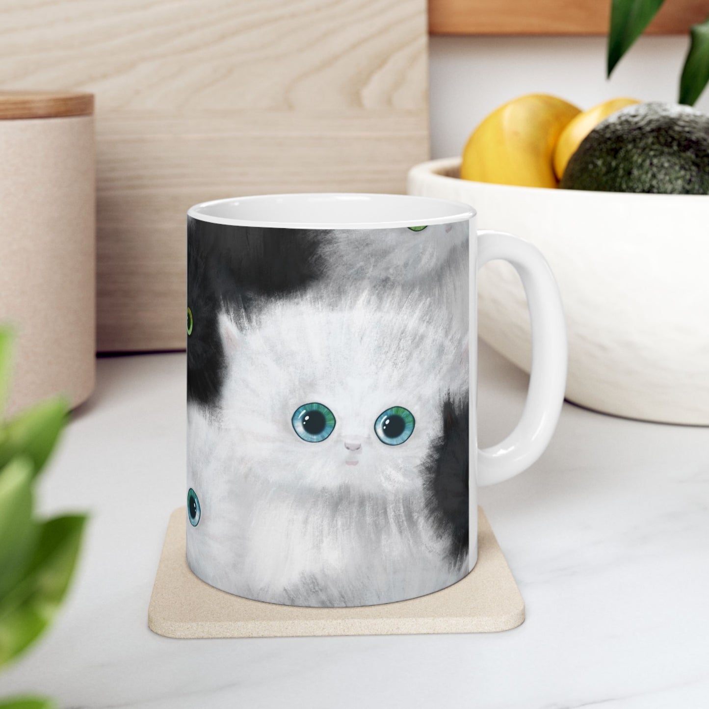Mug with a design of black and white kittens.