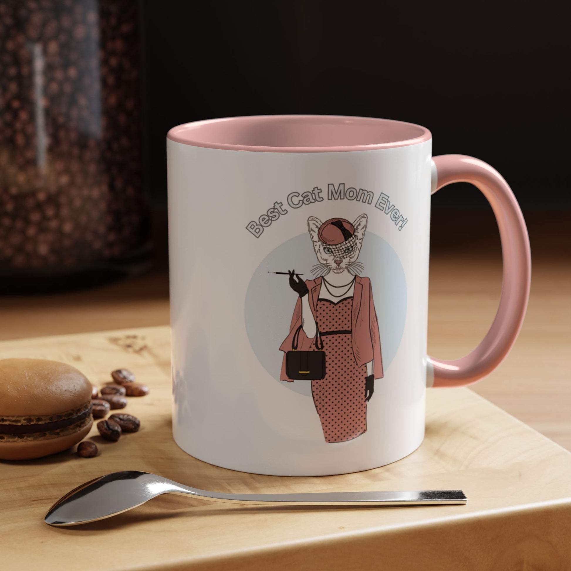 Mug with pink interior and handle featuring a cat illustration and "Best Cat Mom Ever!" text.