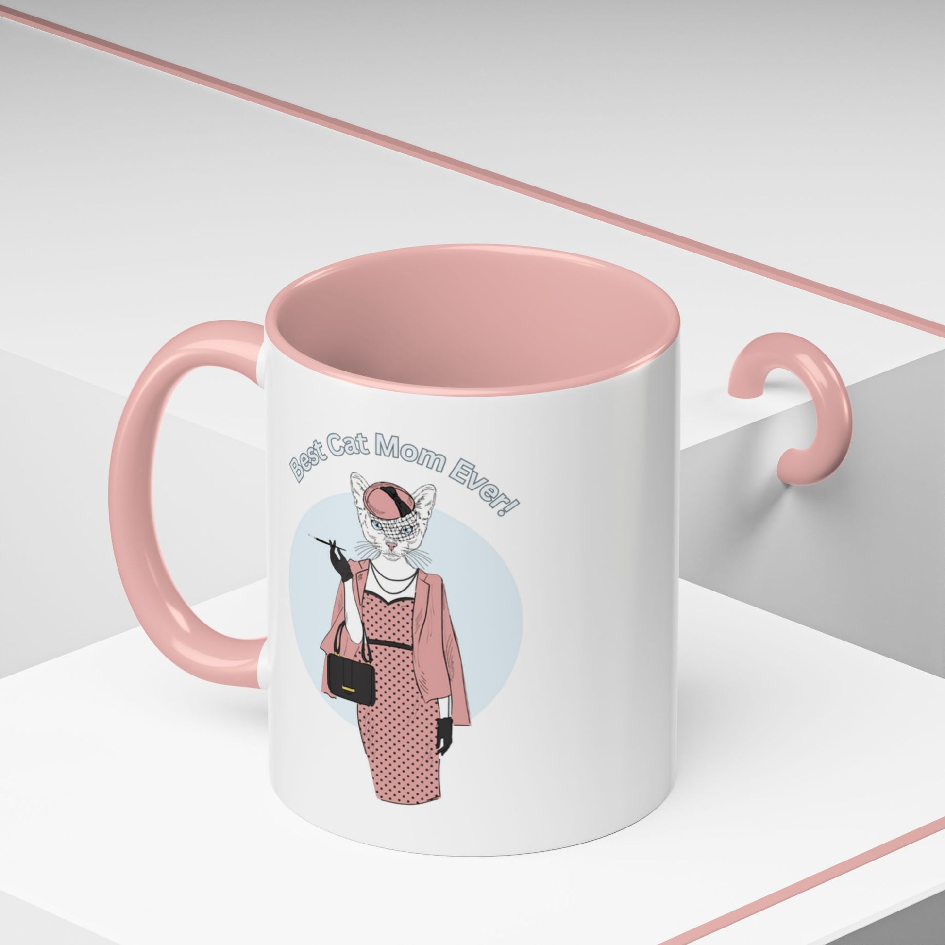 Mug with pink interior and handle featuring a cat illustration and "Best Cat Mom Ever!" text.