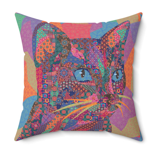 Multi colored throw pillow with a geometric cat design 