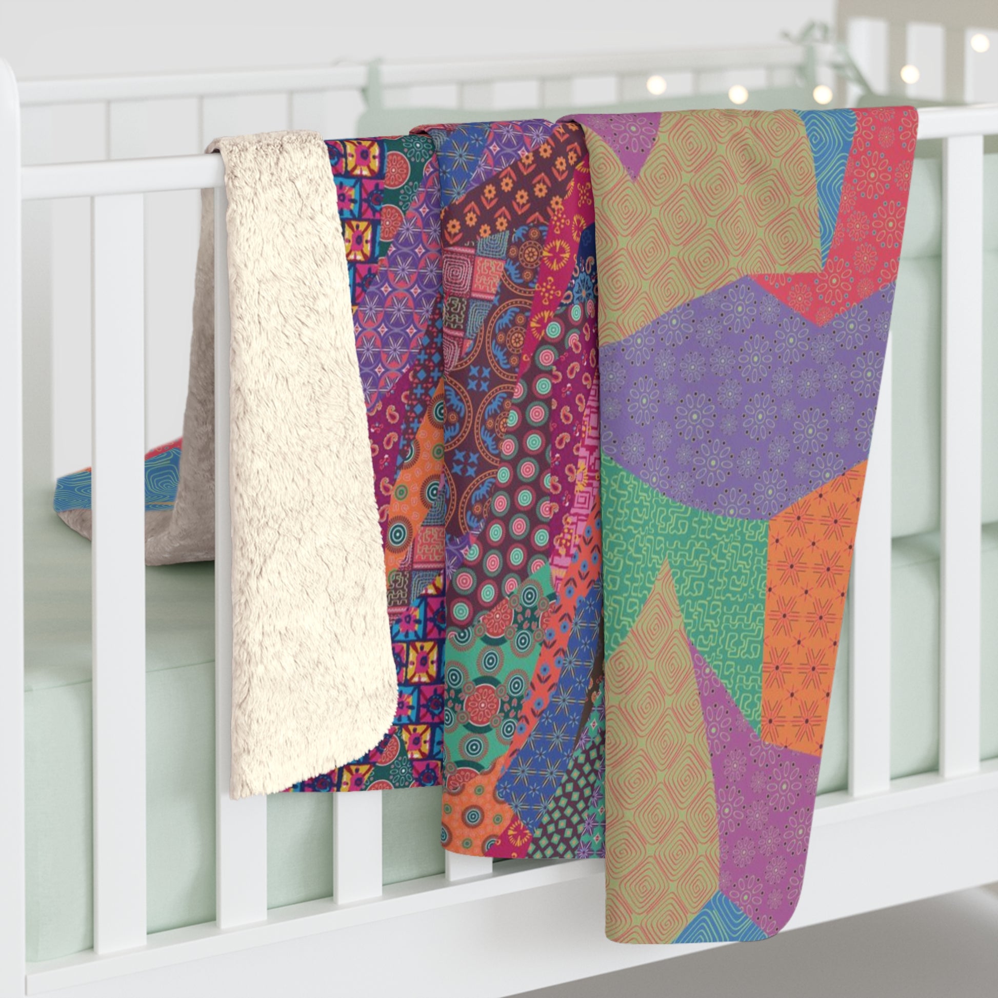 Multicolor fleece indoor throw blanket with a geometric graphic of a cat.