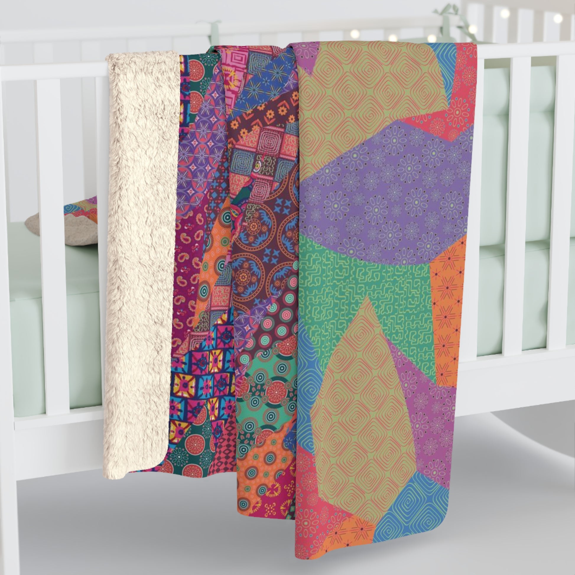 Multicolor fleece indoor throw blanket with a geometric graphic of a cat.