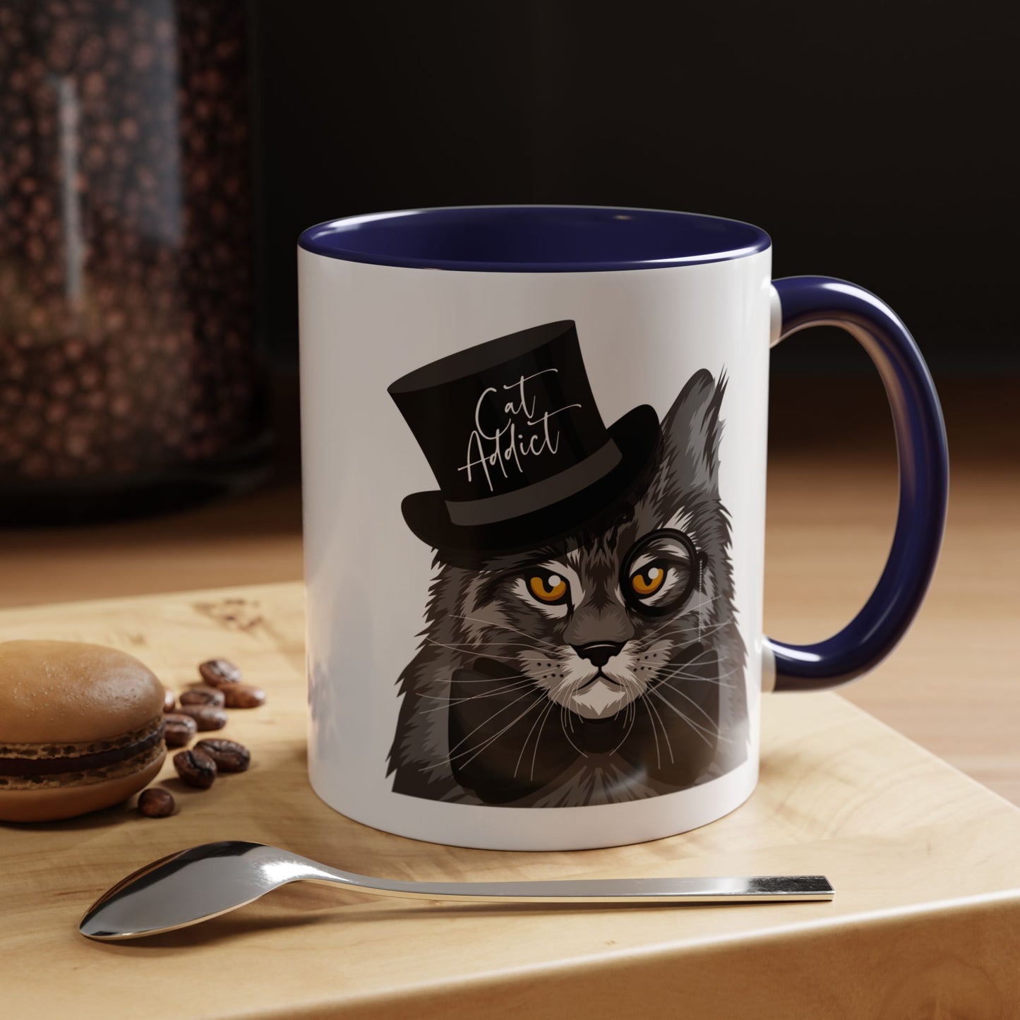 Mug with an illustration of a Maine Coon cat wearing a top hat and the text 'Cat Addict' 