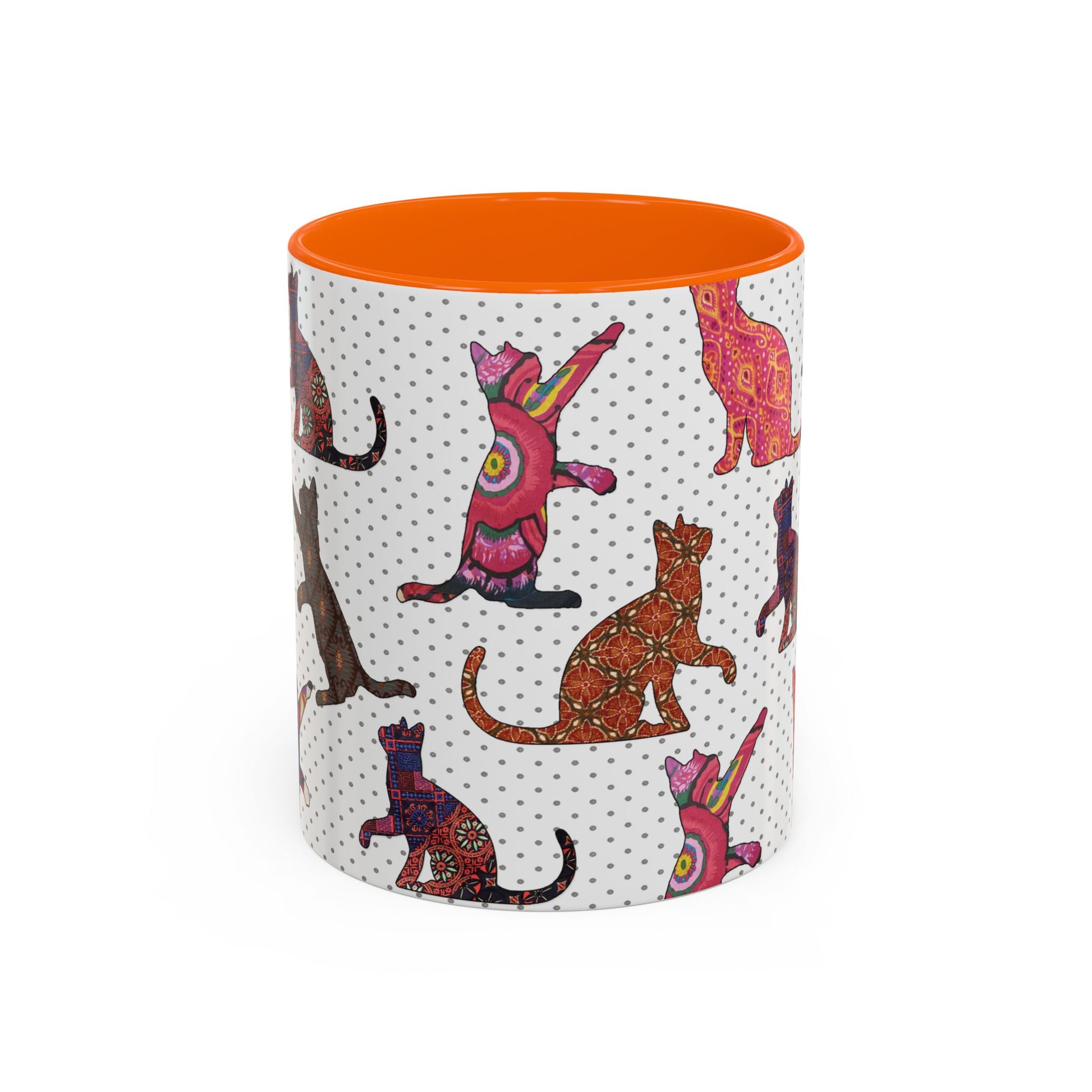 Orange mug with colorful cat silhouette pattern.