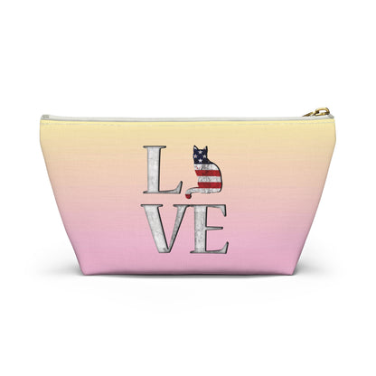 Pink and yellow cosmetic, makeup, toiletries and travel essentials accessory bag with 'LOVE' text design featuring cat silhouette pattern in colors of the American flag.