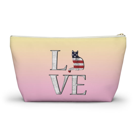 Pink and yellow cosmetic, makeup, toiletries and travel essentials accessory bag with 'LOVE' text design featuring cat silhouette pattern in colors of the American flag.
