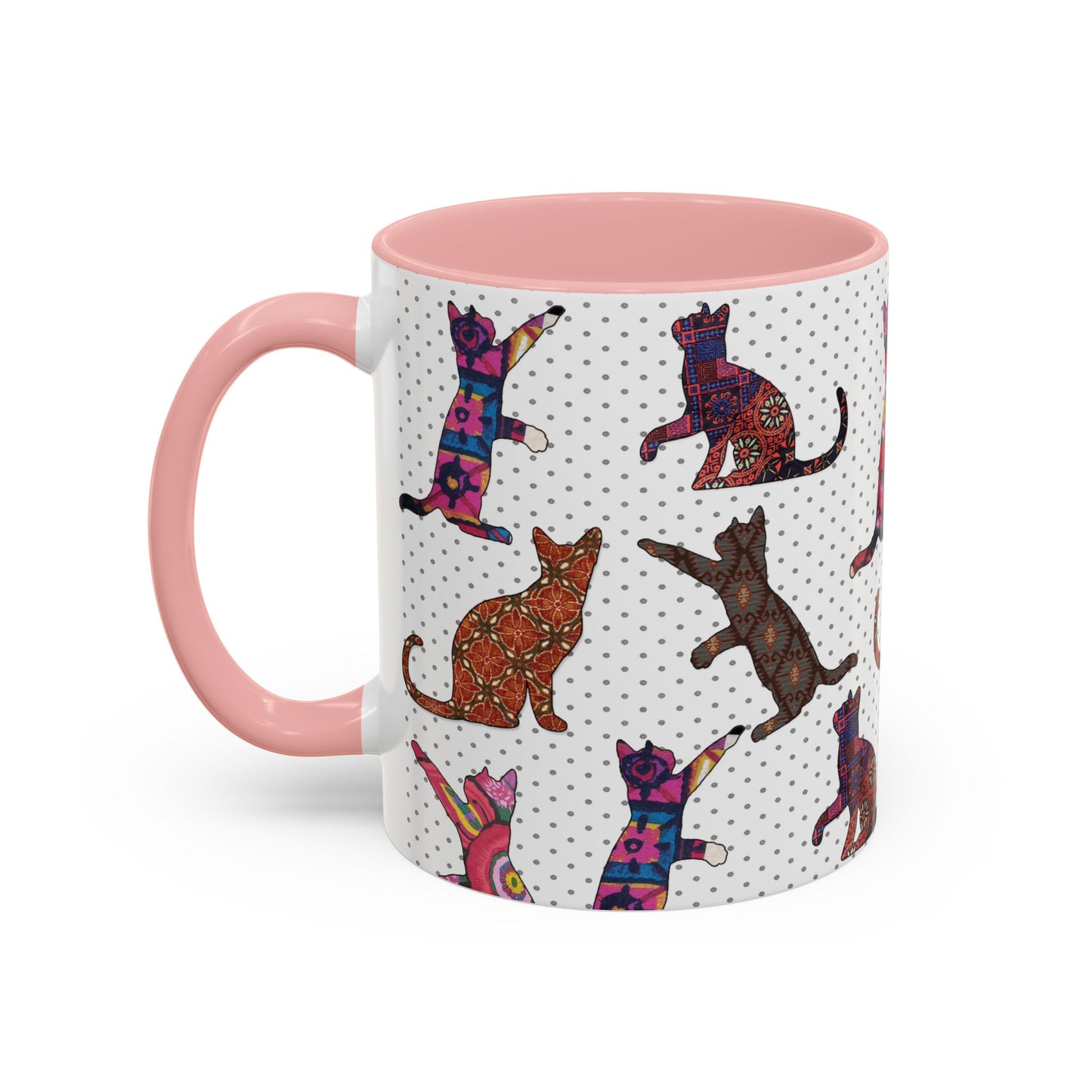 Pink mug with colorful cat silhouette pattern.