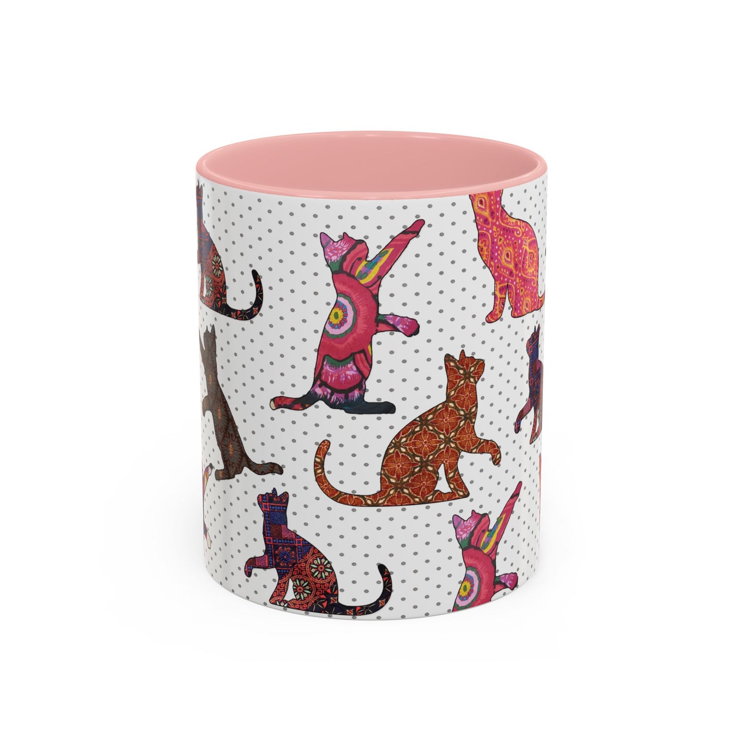 Pink mug with colorful cat silhouette pattern.