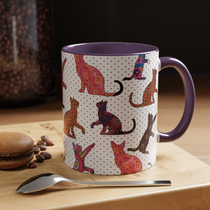 Purple mug with colorful cat silhouette pattern.