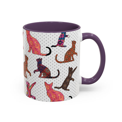 Purple mug with colorful cat silhouette pattern.