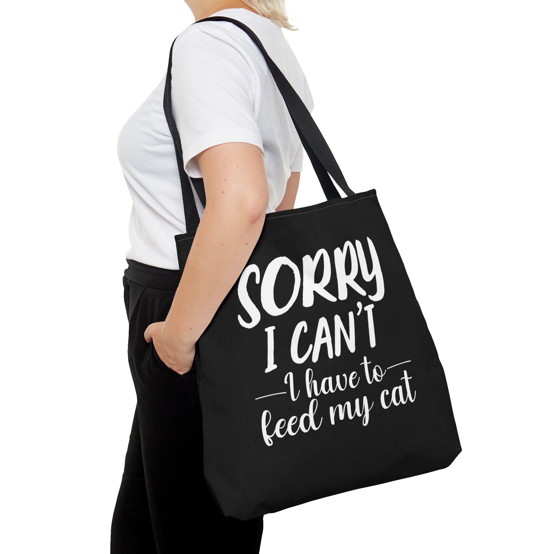 "Sorry I can't i have to feed my cat" black tote bag