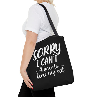 "Sorry I can't i have to feed my cat" black tote bag