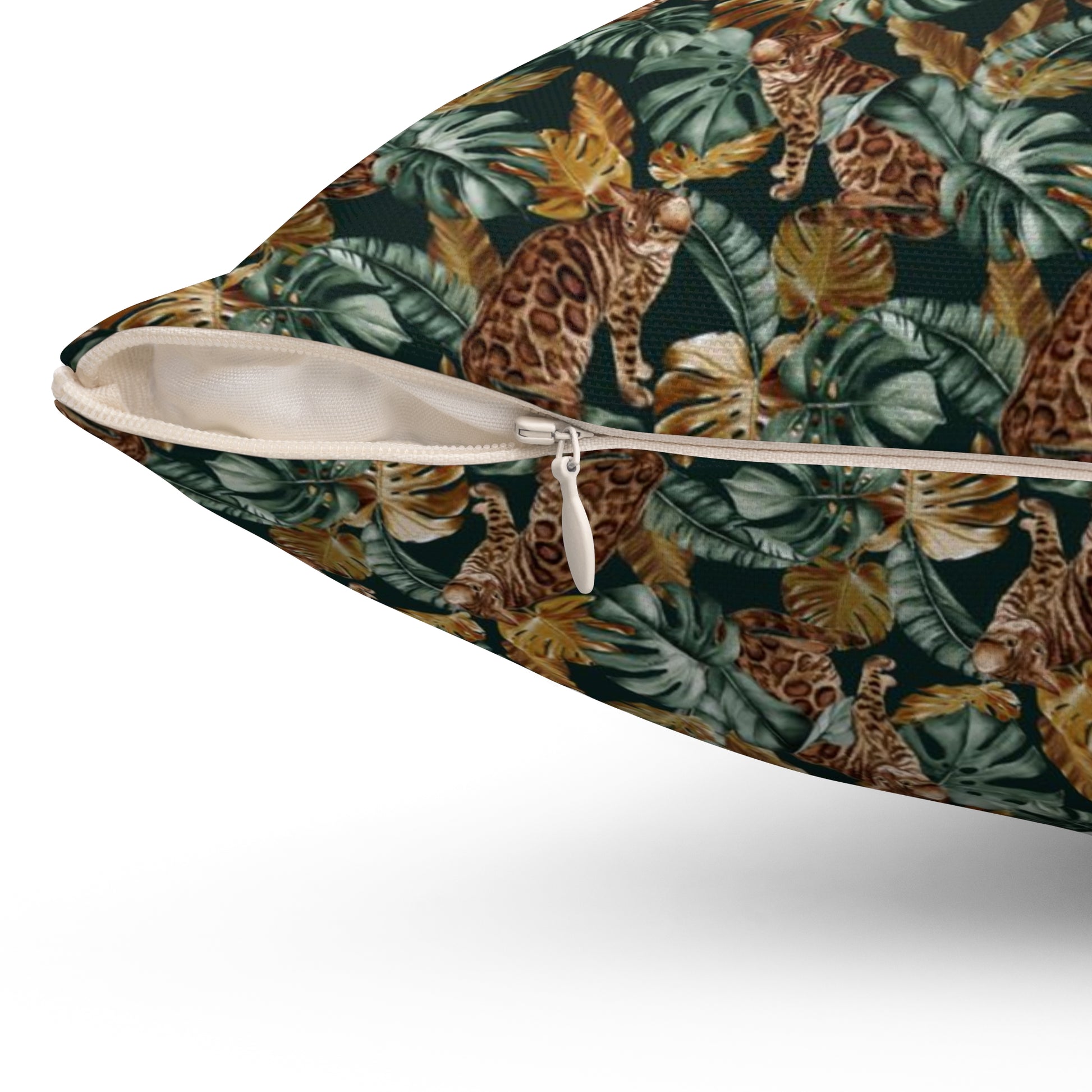 Square throw pillow with Bengal cat and oversized tropical leaf pattern 