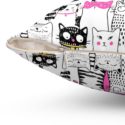 Square throw pillow with black-and-white cartoon cat pattern with bright pink color pop 