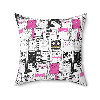 Square throw pillow with black-and-white cartoon cat pattern with bright pink color pop 