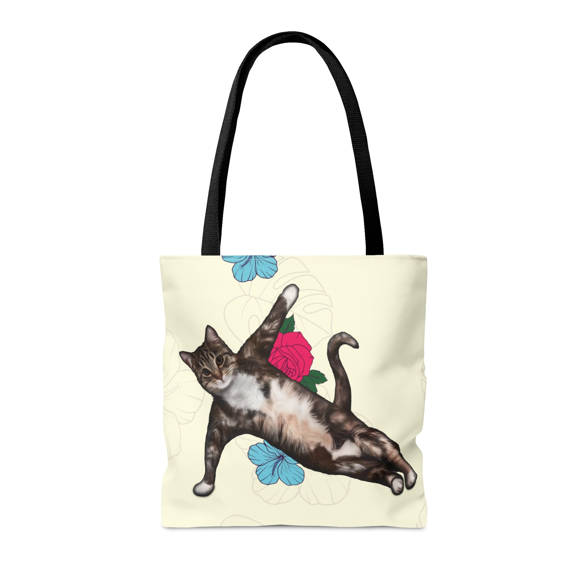 Tote bag with a cat in a yoga pose illustration against floral design on a cream background