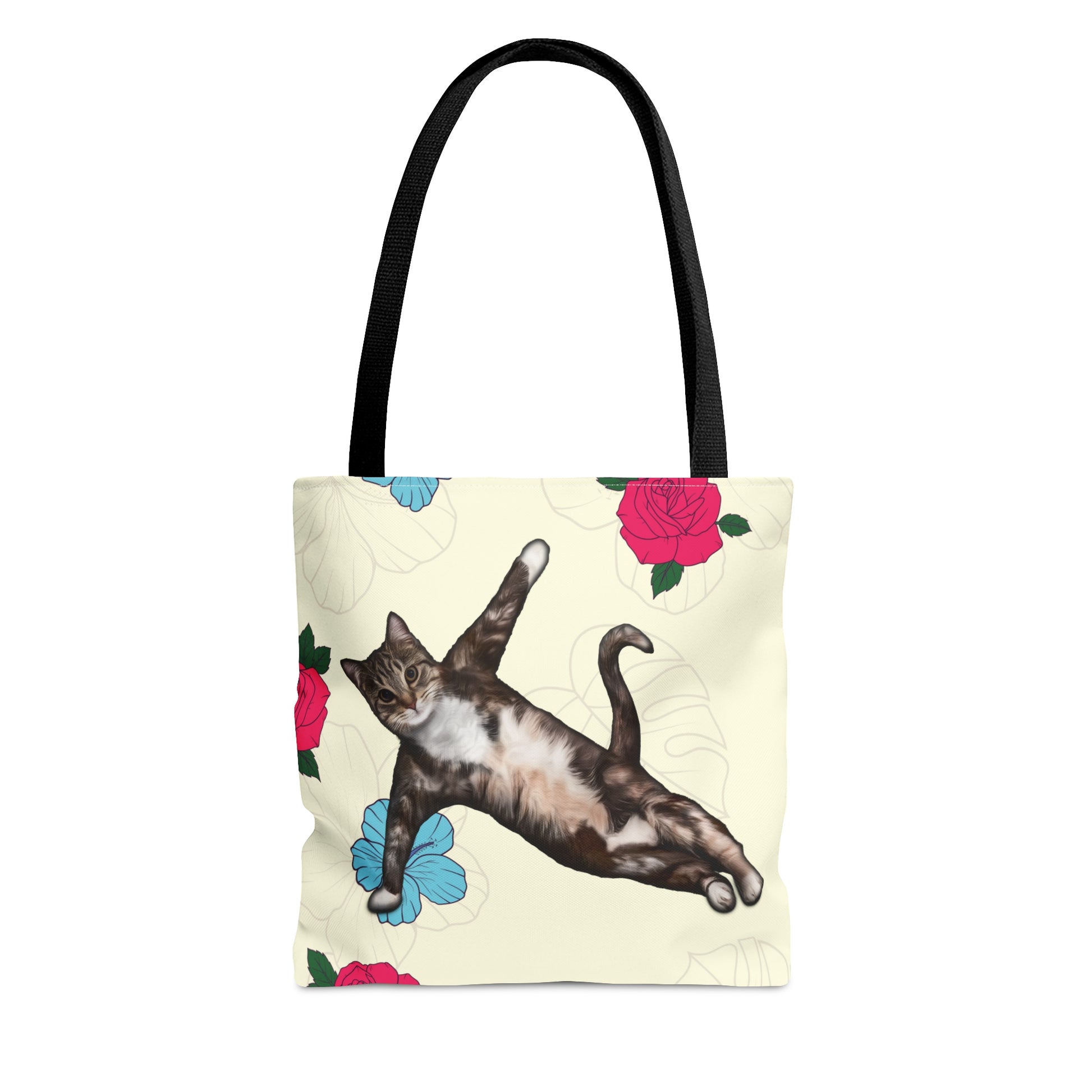 Tote bag with a cat in a yoga pose illustration against floral design on a cream background