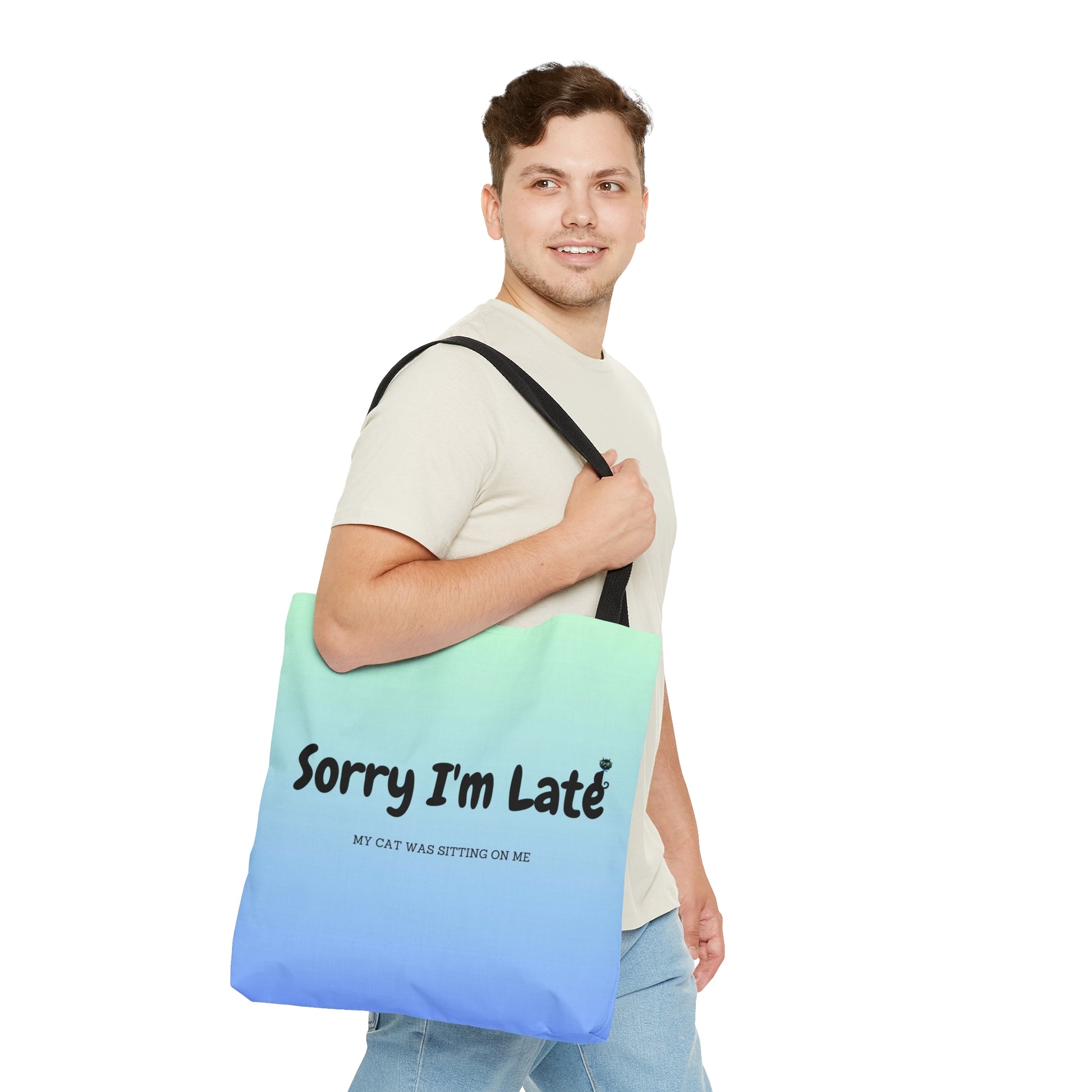 Tote bag with the text "Sorry I'm Late My Cat Was Sitting On Me" and black and white cat illustrations. 