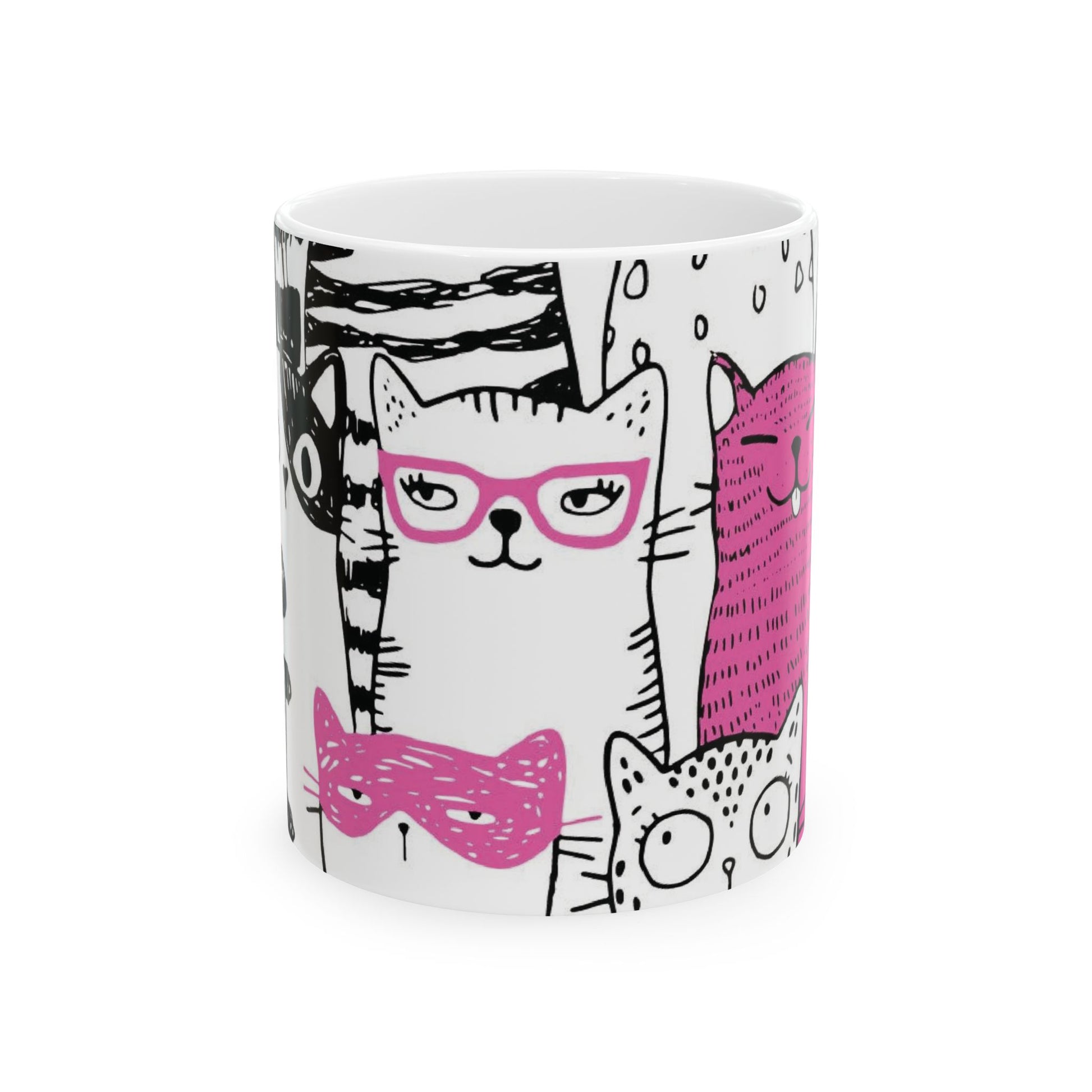 White mug with cartoon black and white cat illustrations.