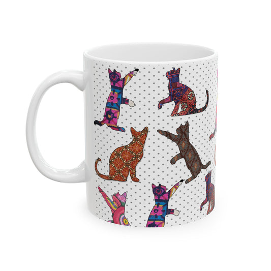 White mug with colorful cat pattern. 
