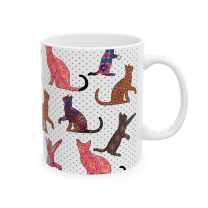White mug with colorful cat pattern. 