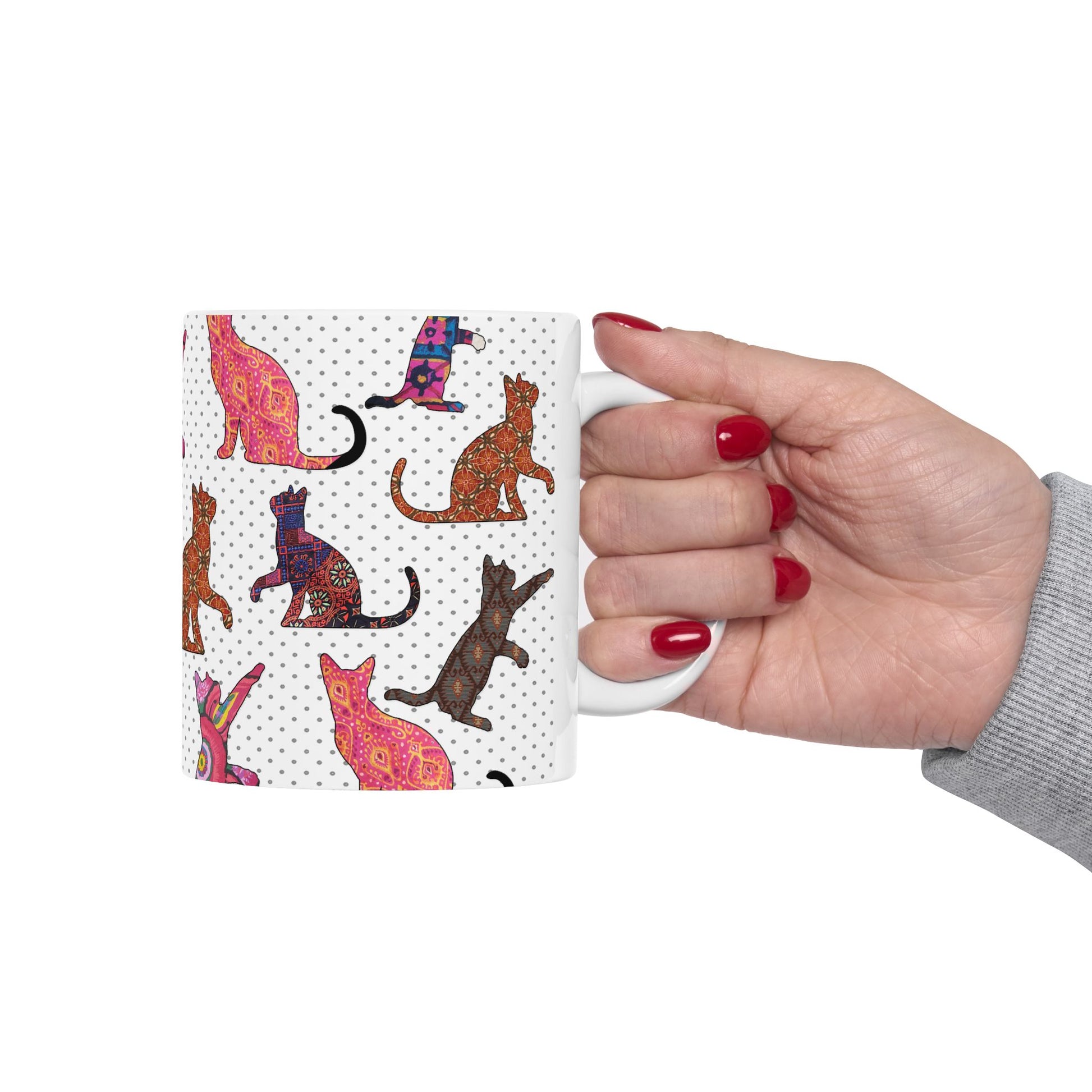 White mug with colorful cat pattern. 