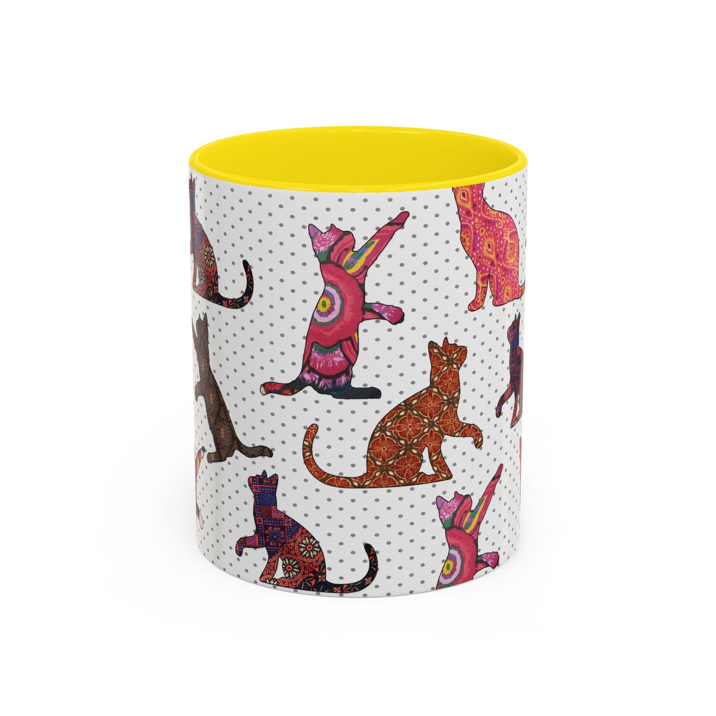 Yellow mug with colorful cat silhouette pattern.